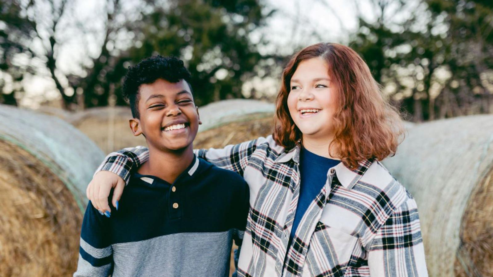 sister with arm around brother adopted from ethiopia, changes in adoption education