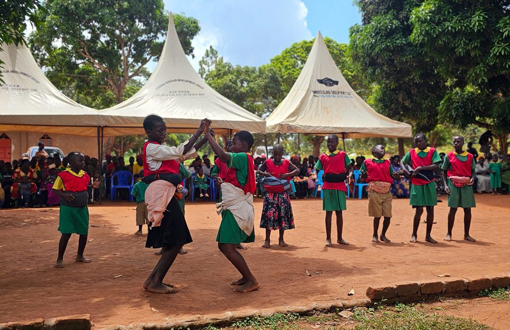 Children dance at the Wakivule school on Uganda's first National Play Day