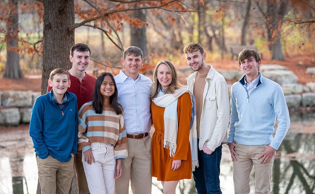 Family photo in the autumn by a river