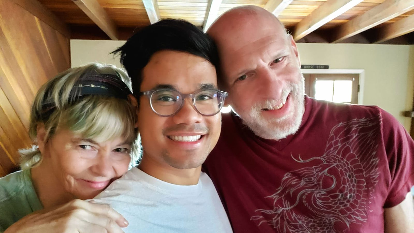 Thai adoptee with his adoptive parents