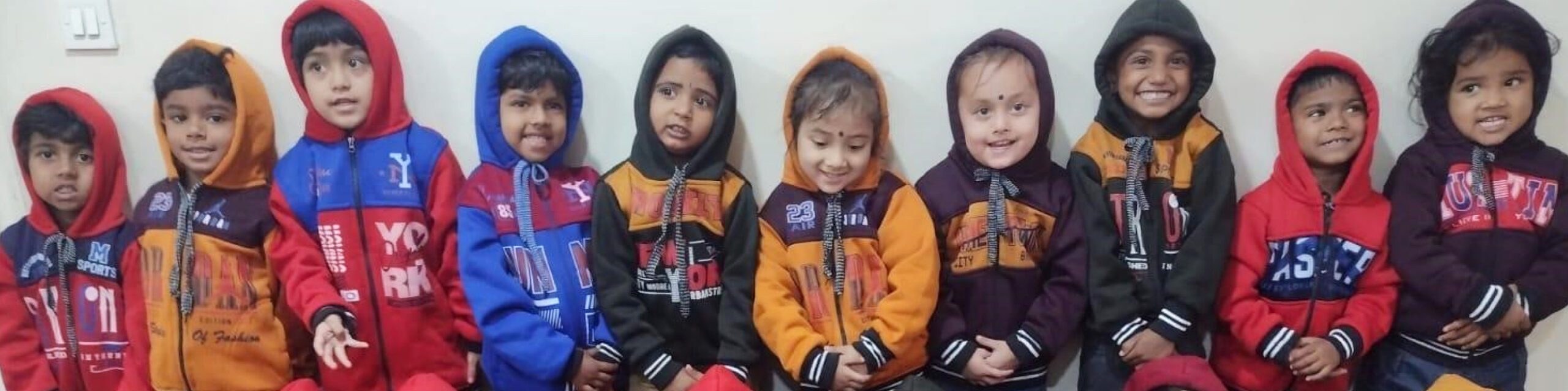 Children at Holt-supported center in India receive warm sweatshirts