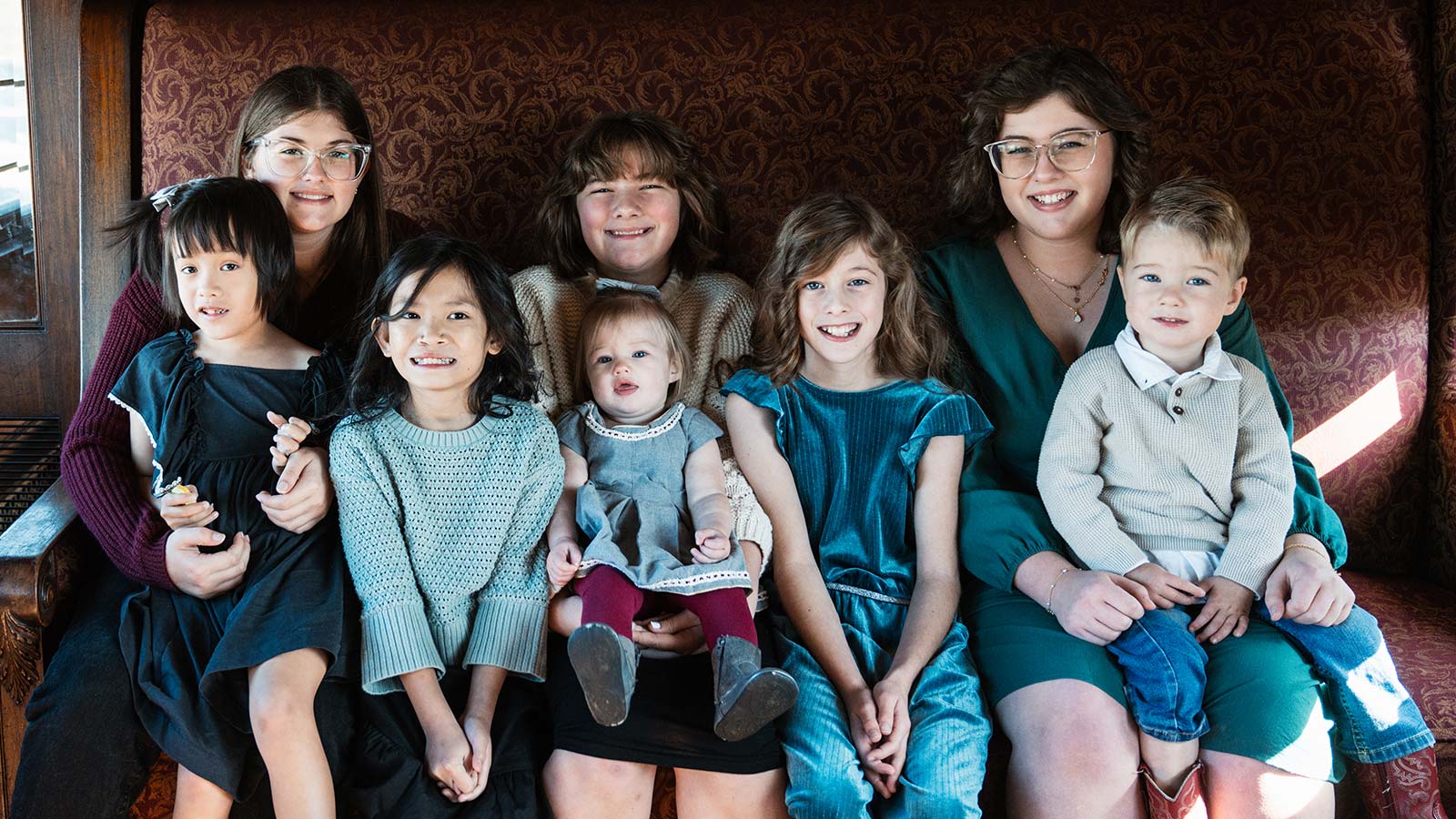 Adopted siblings and biological siblings in a rail car